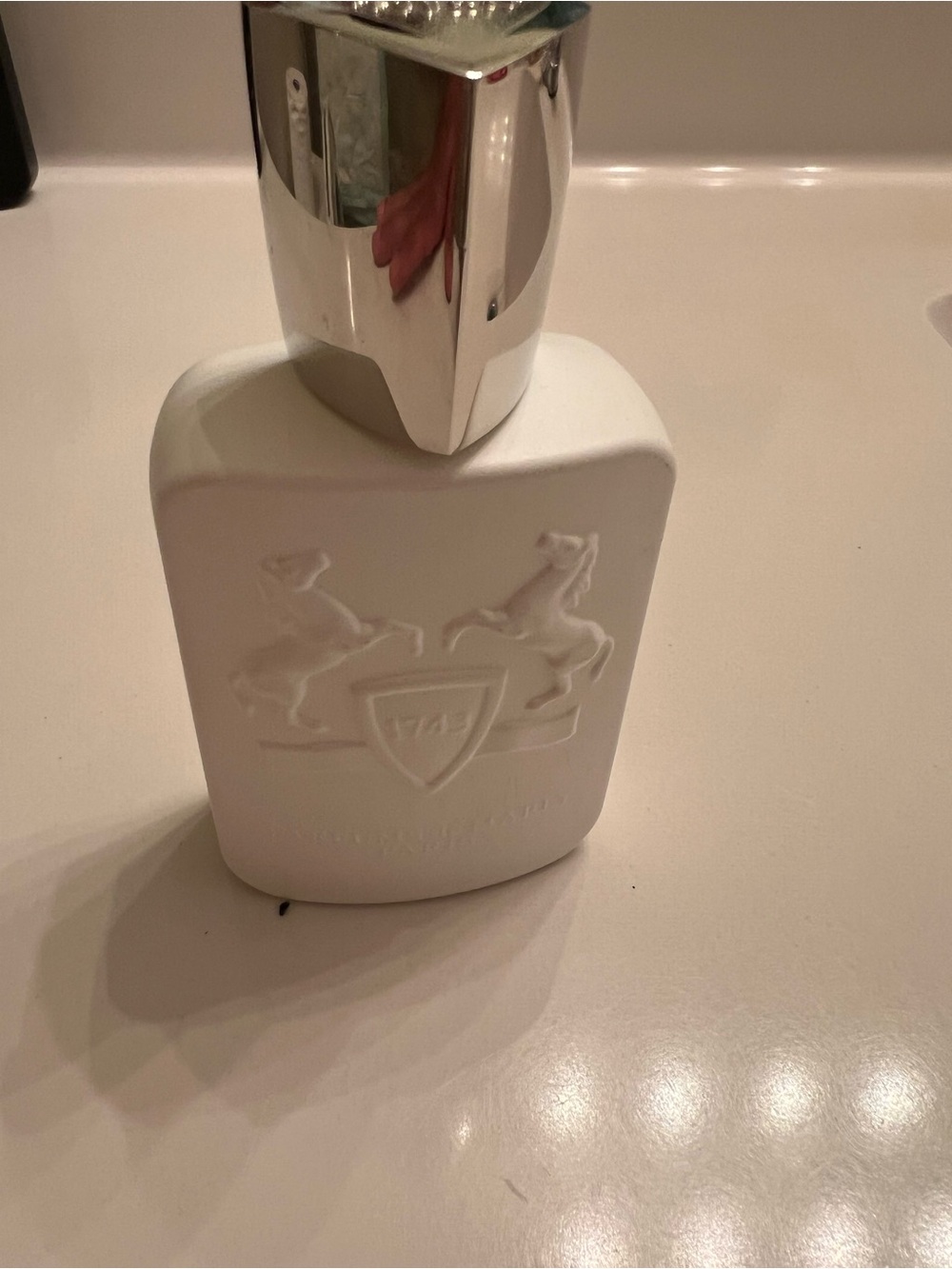White Embossed Ceramic Lotion Dispenser with Silver Pump